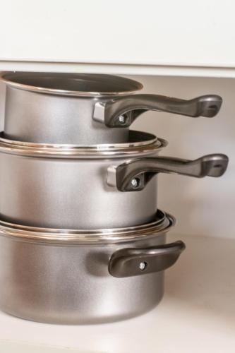 a stack of metal pans sitting on a counter at Long Beach Selfcatering Namibia in Langstrand