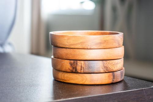 a stack of wooden bowls sitting on a table at Long Beach Selfcatering Namibia in Langstrand