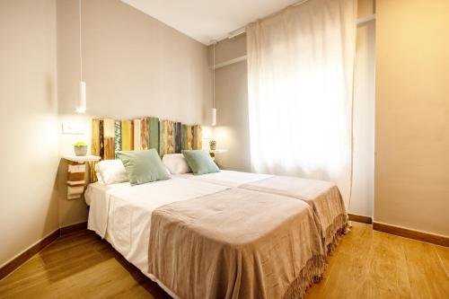 Un ou plusieurs lits dans un hébergement de l'établissement K-NAVY by Nuka Homes