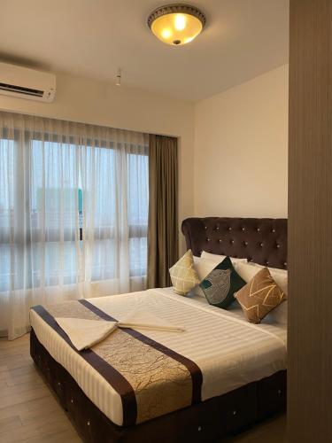 Katil atau katil-katil dalam bilik di Agile Orchid service residence TRX by KL