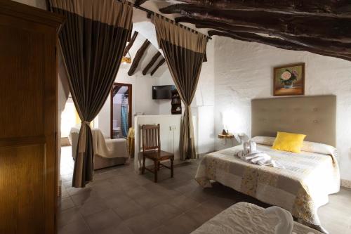 Postel nebo postele na pokoji v ubytování Molino de Lucero, casa rural