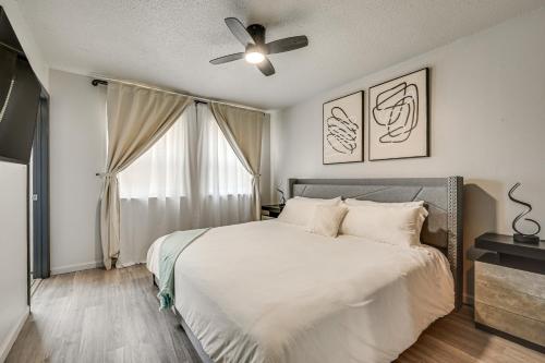 a bedroom with a bed and a ceiling fan at Townhome 1 Mi to Colt Park and Industrial District! in Hartford