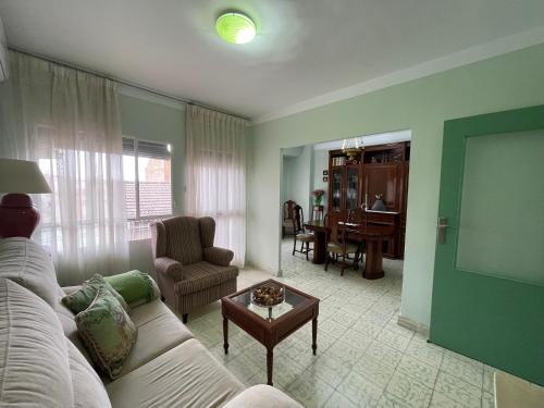 a living room with a couch and a table at LA CASA VERDE -Mancha Real-Jaen-Ubeda-Baeza in Mancha Real