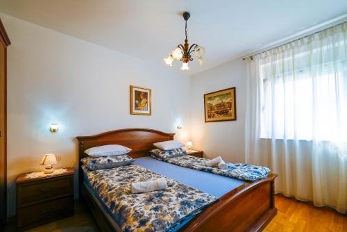 Postel nebo postele na pokoji v ubytování Apartment Emma