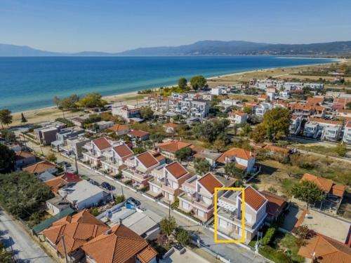an aerial view of a town next to the ocean at Aegean dream house in Ofrínion