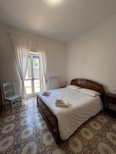 Ένα ή περισσότερα κρεβάτια σε δωμάτιο στο Casa Anna a 100mt dal mare