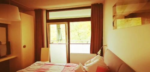 a room with a window and a bed in a room at Urlaub mit Sauna und Pool ist cool! in Bad Harzburg