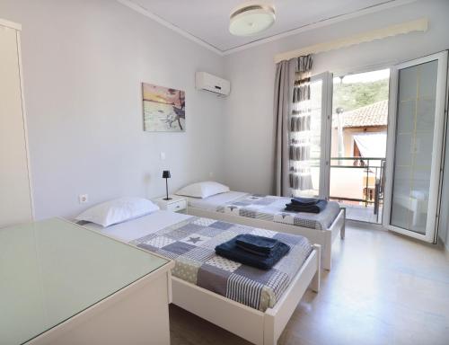 Ένα ή περισσότερα κρεβάτια σε δωμάτιο στο Tassos Village House