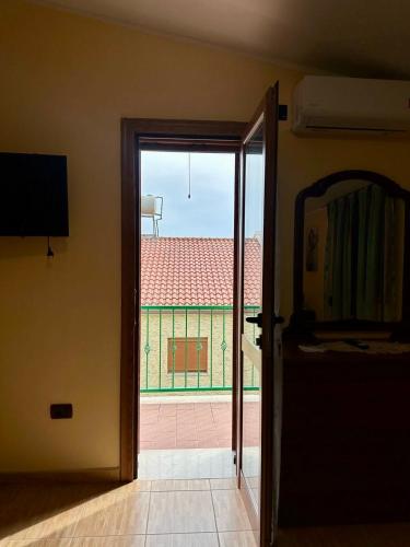 an open door with a view of a building at VilaHasa in Tërbuf