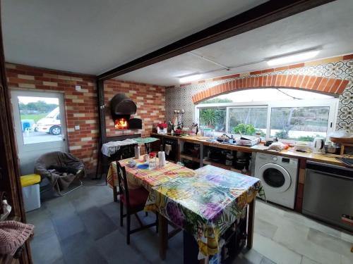 a kitchen with a table in the middle of it at Quinta das Lameiras in Sao Pedro de Tomar