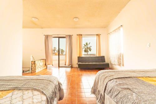 Ένα ή περισσότερα κρεβάτια σε δωμάτιο στο Beach House Rosarito