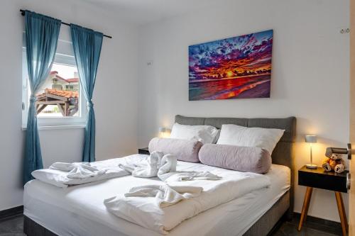 Ένα ή περισσότερα κρεβάτια σε δωμάτιο στο Apartments Strand