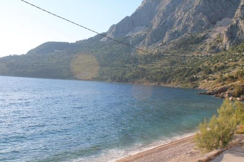 a view of a body of water with mountains at Apartments Alać in Drasnice
