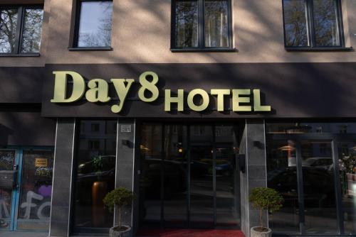 a day and hotel sign on the front of a building at Day8 Hotel in Cologne