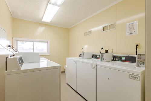 a laboratory with white counters and machines in a room at 1 BD Boulder Getaway - Pets Allowed with Full Amenities in Boulder