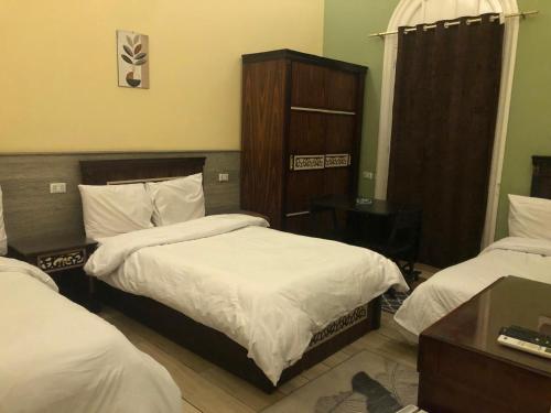 Katil atau katil-katil dalam bilik di Boutique Centro Citta Hotel