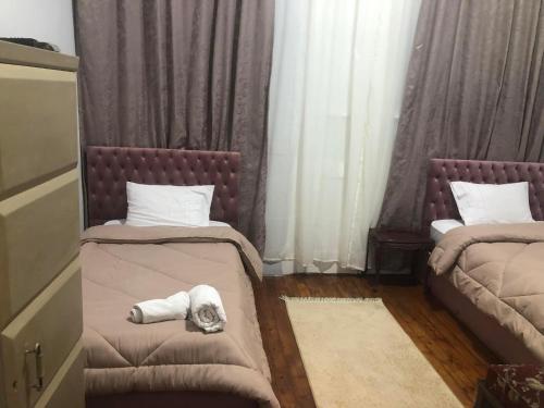 Katil atau katil-katil dalam bilik di Boutique Centro Citta Hotel