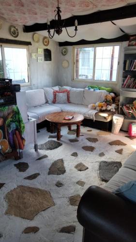 a living room with a couch and a coffee table at Caravana em Quinta das Lameiras in Tomar