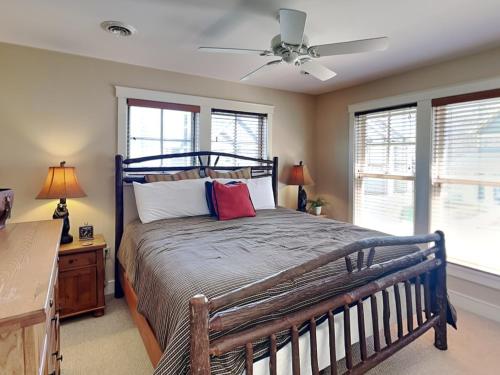 a bedroom with a bed and a ceiling fan at Some Kind of Wonderful in Oakland