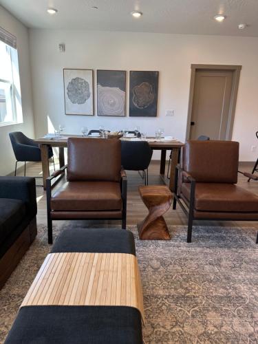 a conference room with a table and chairs at Sonoro Sands in Hurricane