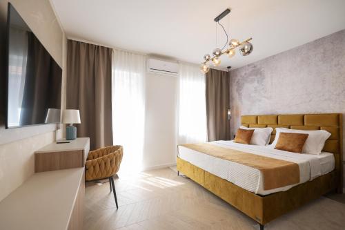 a bedroom with a bed and a large window at Platea Magna Lux Apartment in Zadar