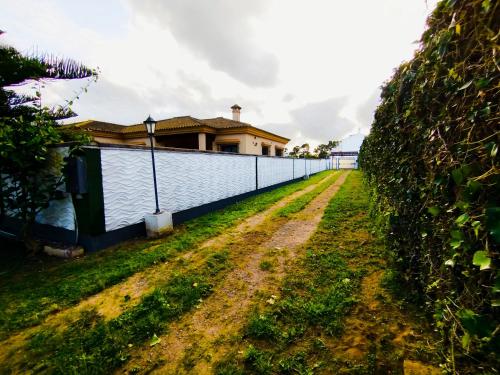 a fence in front of a house at The Magic House in El Puerto de Santa María