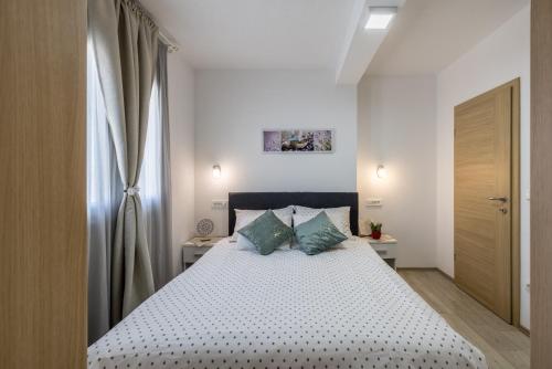 Voodi või voodid majutusasutuse Apart sa Terasom 250m od Plaže,Parking,Wi Fi,Roštilj toas