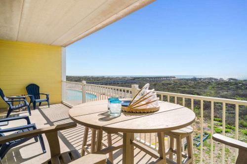 a table on a balcony with a view of the ocean at Grand Caribbean 2009 in Port Aransas