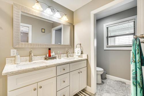 a bathroom with a sink and a mirror at Lakefront Boating Getaway in Spring City! in Spring City
