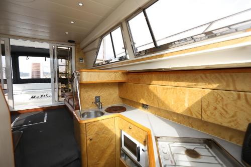 a kitchen in an rv with a sink at Shannon River Escape in the center of Athlone in Athlone