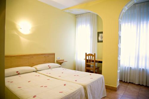 Postel nebo postele na pokoji v ubytování Hostal Orejas