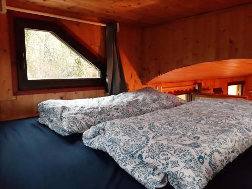 Postel nebo postele na pokoji v ubytování Urlaub in der Bauwagenidylle
