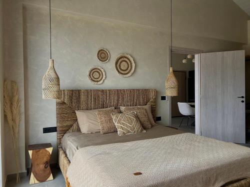 a bedroom with a large bed in a room at XTC Villas Kefalonia - Villa X in Argostoli