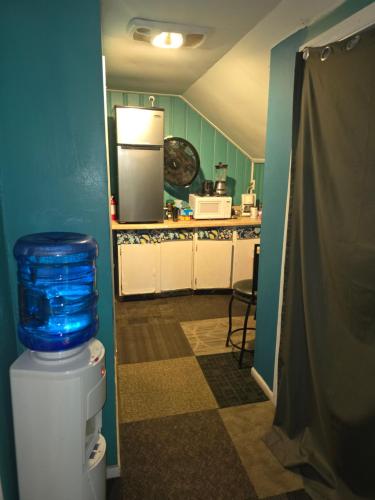 a kitchen with a refrigerator and a counter top at Grateful Hemphill B in Atlanta
