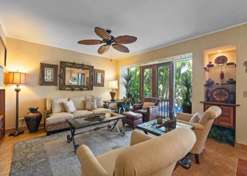 a living room with a couch and chairs at Bahia Pez Vela Resort in Ocotal