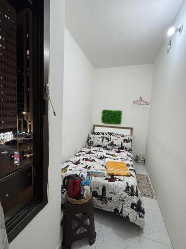 a bedroom with a bed with a comforter with animals on it at Abel homes in Abu Dhabi