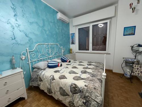 Postel nebo postele na pokoji v ubytování Casa di Amos con parcheggio privato