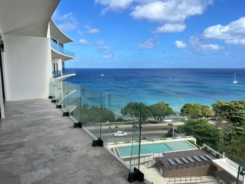 a view of the ocean from the balcony of a building at DSoleil in Cozumel