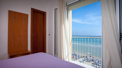 Postel nebo postele na pokoji v ubytování Hotel Florence