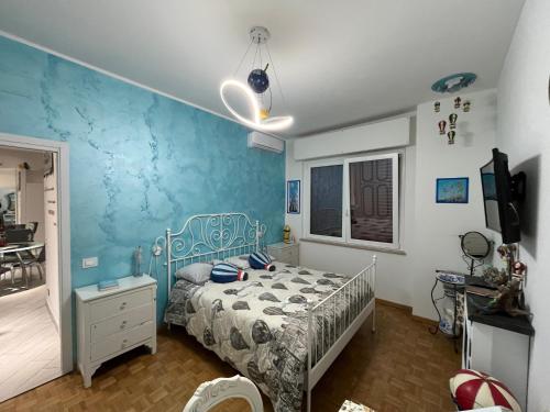 Postel nebo postele na pokoji v ubytování Casa di Amos con parcheggio privato