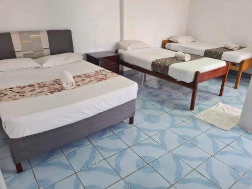 Postel nebo postele na pokoji v ubytování Tavua Hotel Ismail Investments