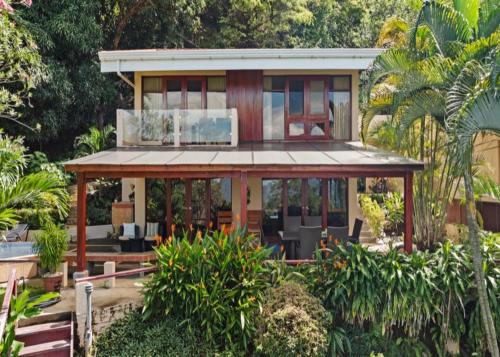 a house in the middle of a garden at Bahia Pez Vela Resort in Ocotal