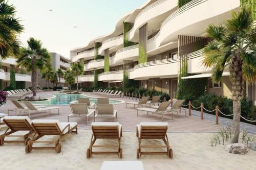 a resort courtyard with lounge chairs and a swimming pool at LuxuryApartmentBaiaBlanca Pool & Free Parking in Lido di Jesolo