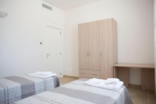 Postel nebo postele na pokoji v ubytování Tenuta Masiedd