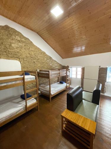 Postel nebo postele na pokoji v ubytování Albergue Amodiño