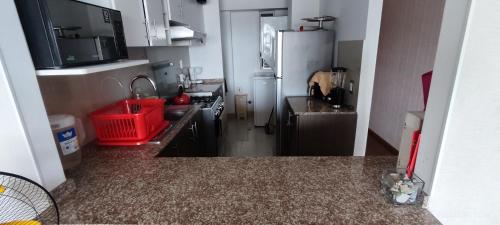 Kuchyň nebo kuchyňský kout v ubytování douha mi departamento de 3 habitaciones