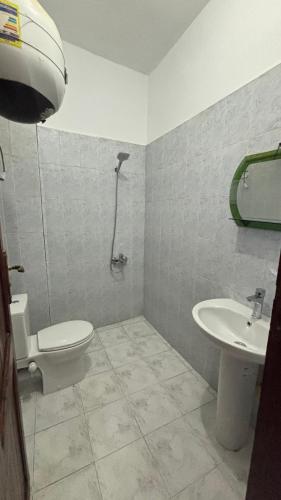 a bathroom with a toilet and a sink at Sina house in Dahab