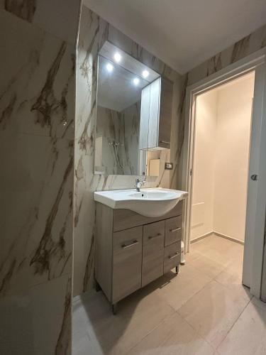 a bathroom with a sink and a mirror at Magic Dream , Bari in Bari