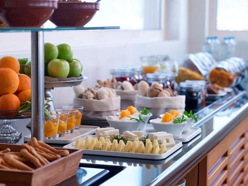 a buffet with a lot of food on a table at Pharae Palace in Kalamata