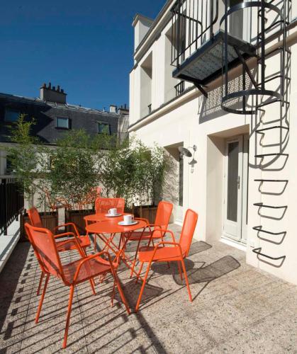 Un balcón o terraza en Hôtel Helzear Champs-Elysées